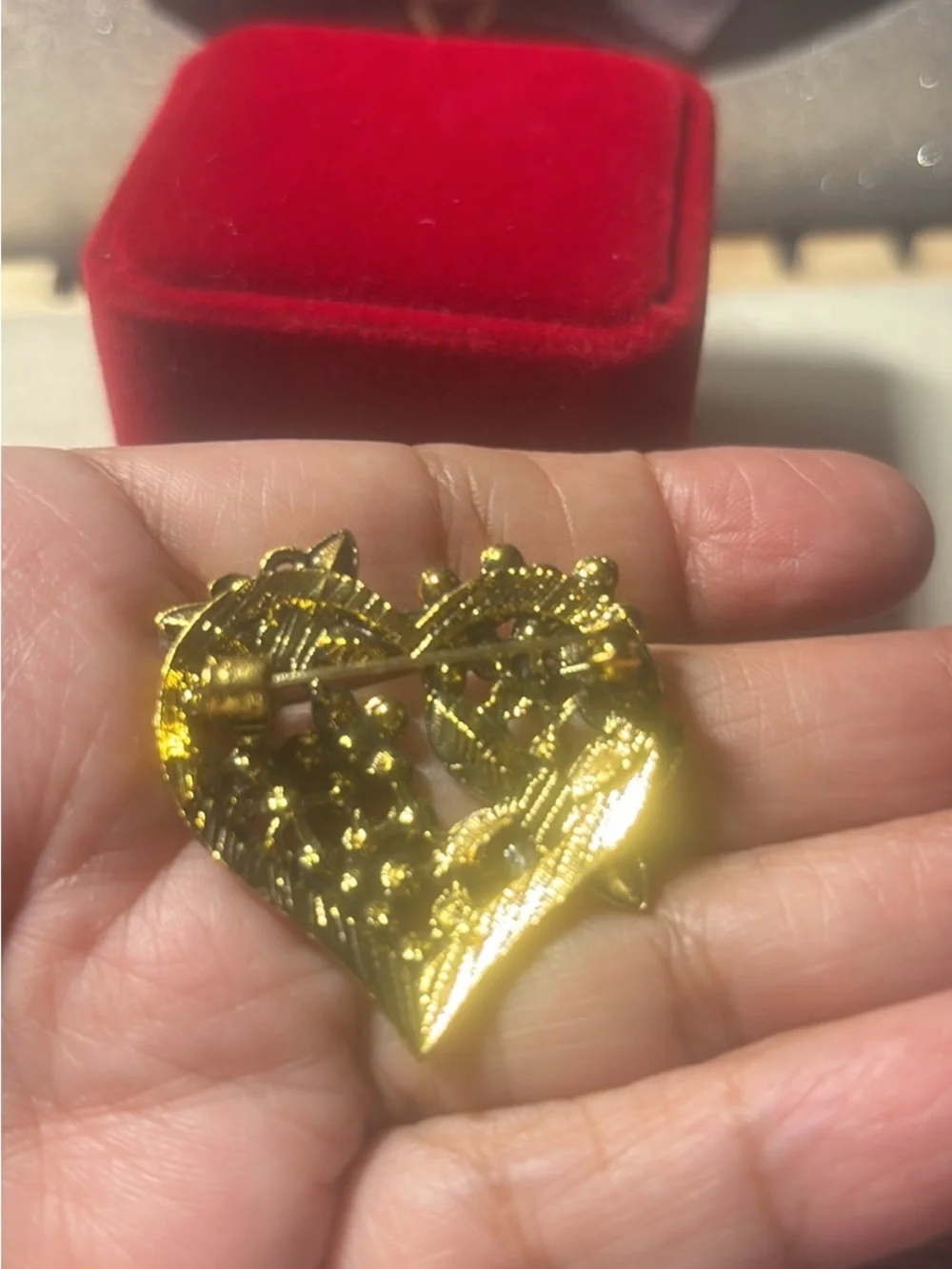 Gold-Tone Red Crystal Heart Brooch with Floral Accents